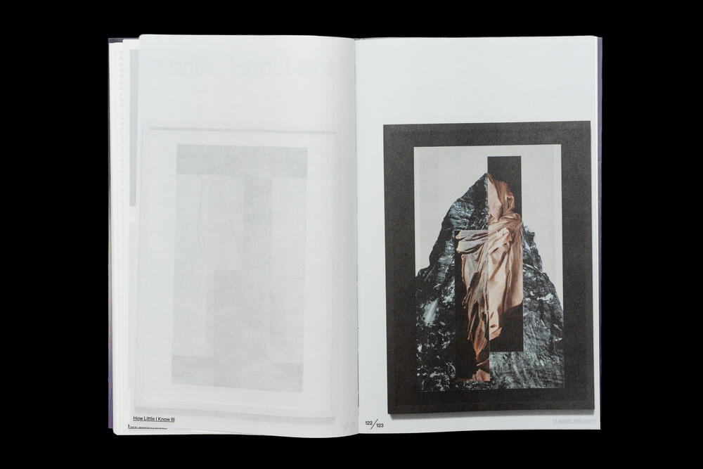 An open exhibition catalog displaying two pages: the left page is blank with a light gray background, while the right page features a framed artwork with a dark border showing a figure in classical robes against a textured dark background.
