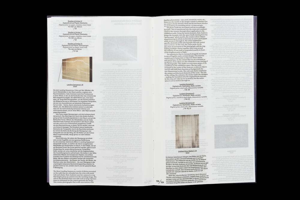 Two open pages from an exhibition catalog featuring academic text in German, with two photographs of wooden interior architectural elements or installations positioned on the right page and lower left area.